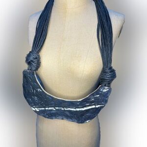 Bold hammered metal necklace with suede